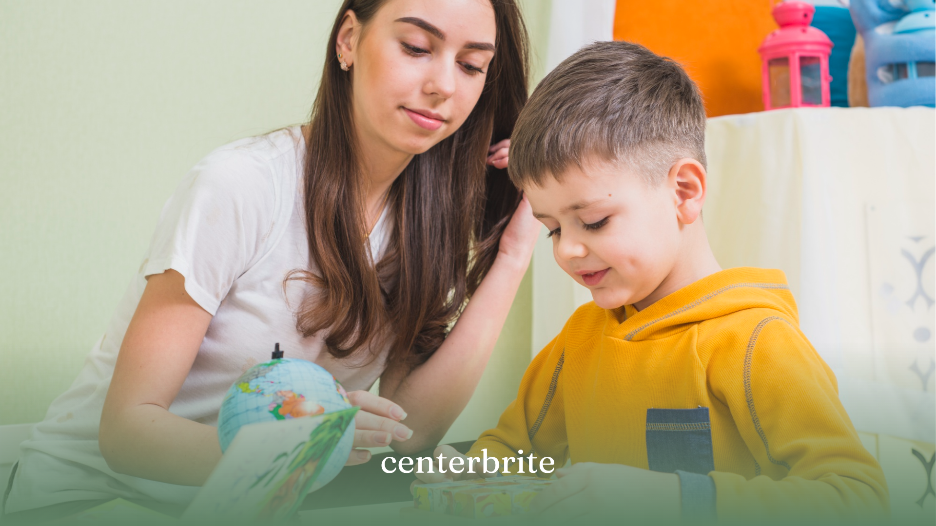 A child and his mom working on a school work together