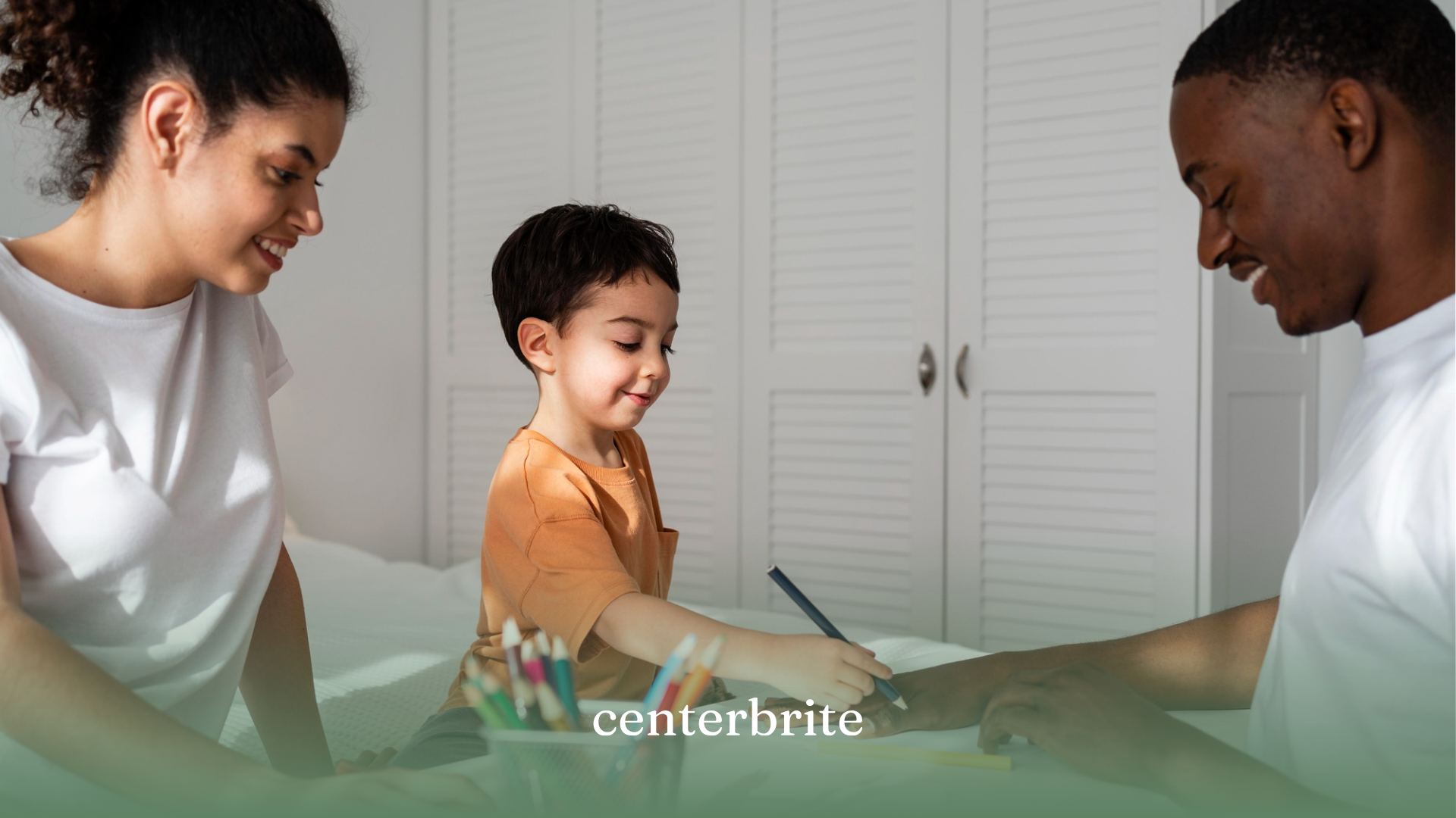A kid with his parents doing an activity during ABA therapy