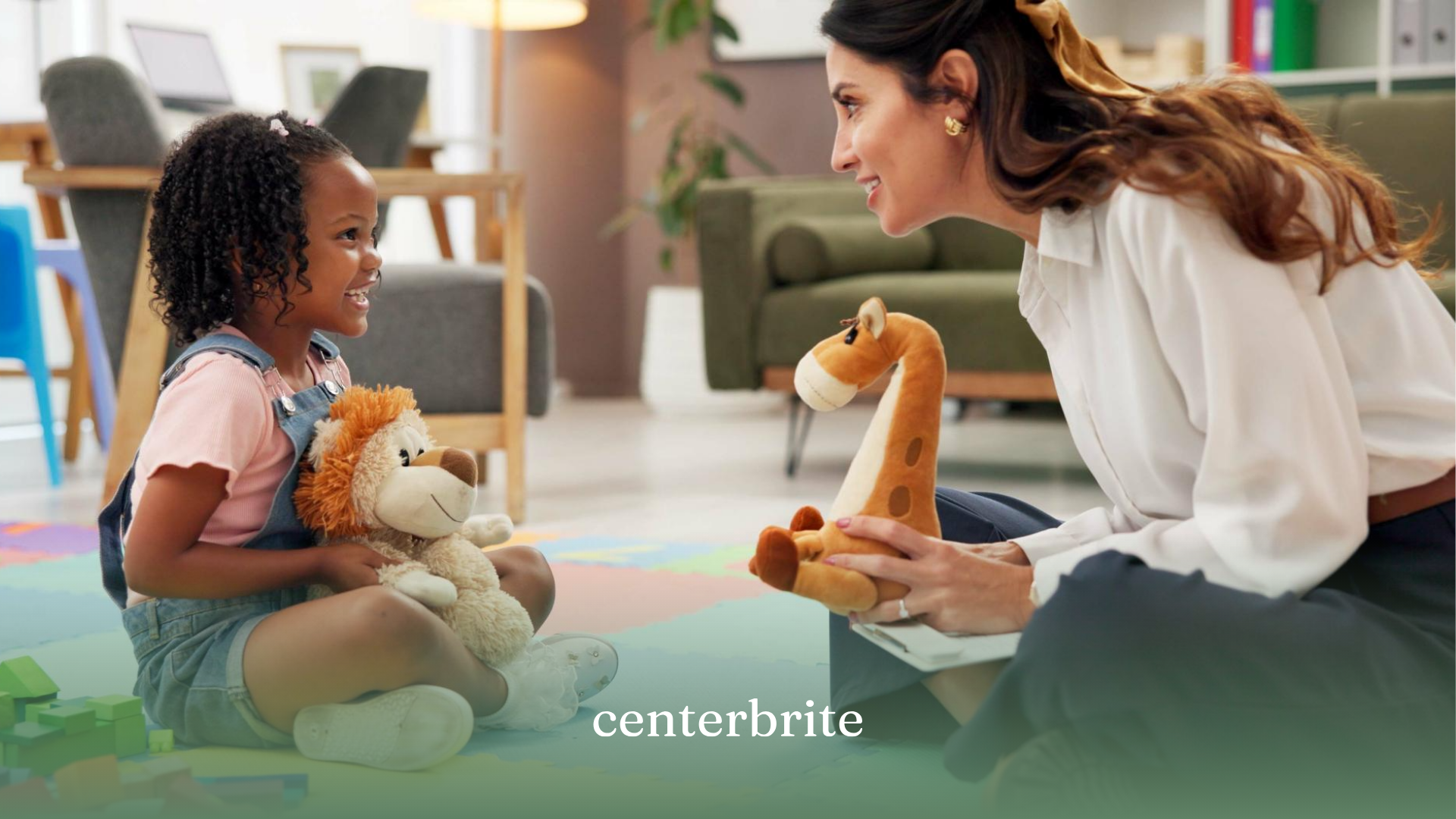 A child and an ABA therapist playing with stuffed animals during ABA therapy